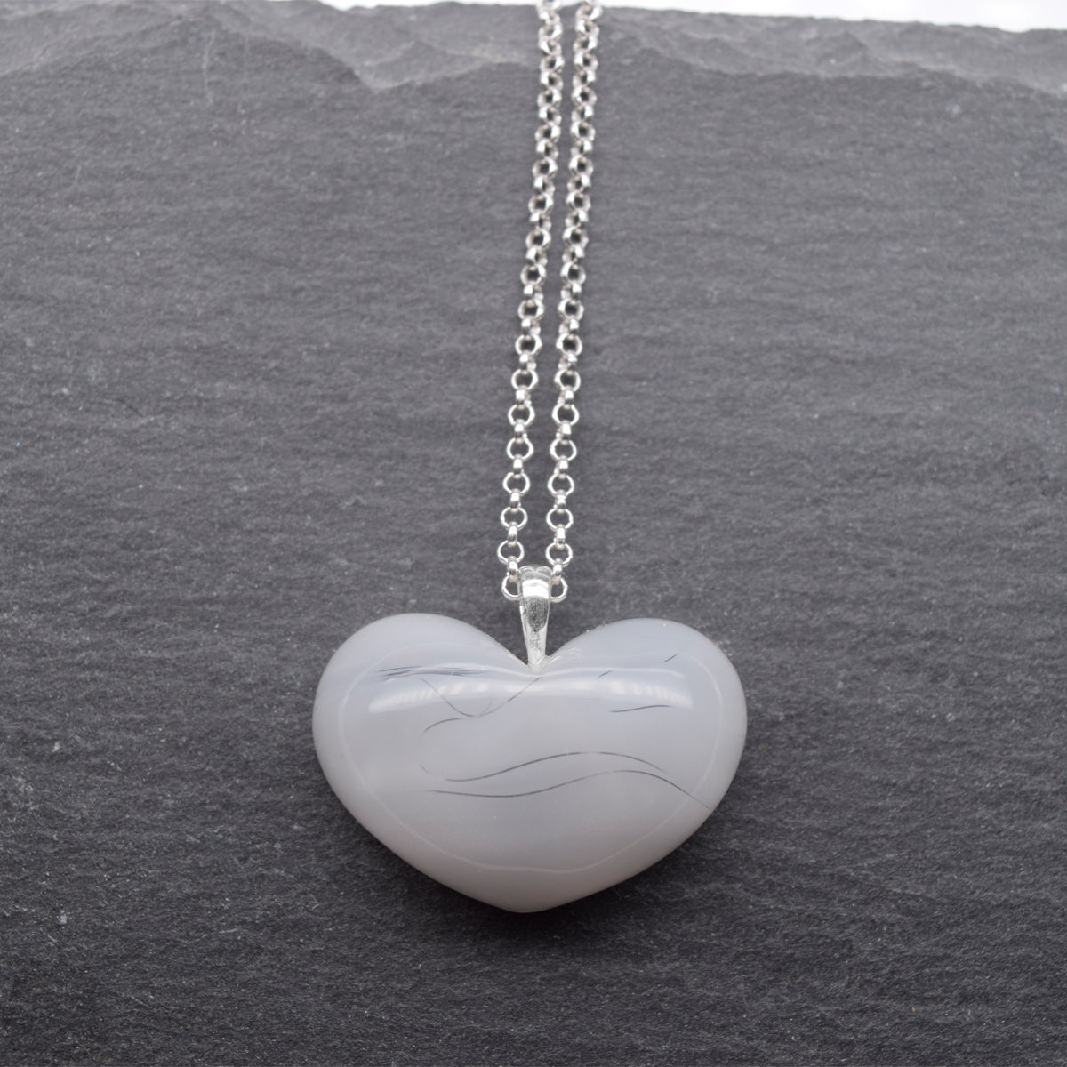 Wooden heart pendant + visible ash dust